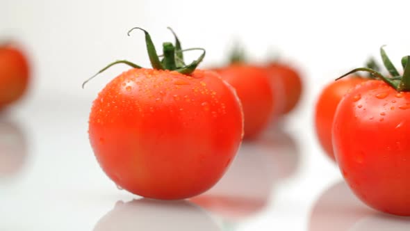 Fresh tomatoes on white