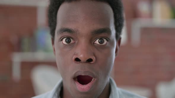 Close Up of African Man Feeing Shocked at the Camera