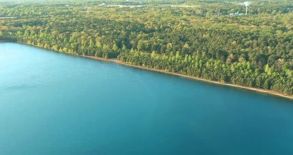 Panoramic View to Lake Near the Spring Forest in Sunny Day