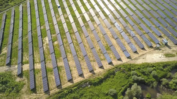 Aerial view of solar power plant field. Electrical photovoltaic panels for producing clean ecologic