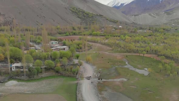 Aerial Over Local Ghizer Valley Village In Pakistan. Slow Pedestal Up