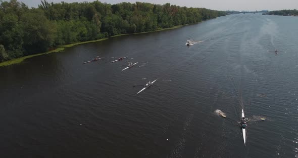 Sports Canoe Driven By Team Men Women Sailing Along Calm River with Sun