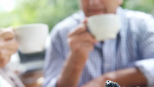 Senior couple having coffee in cafe 4k