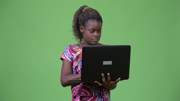 Young African Woman Using Laptop