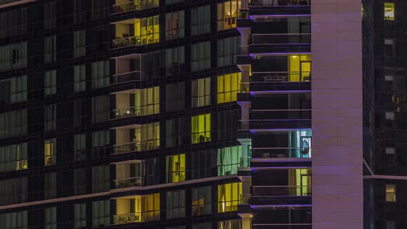 Night View of Exterior Apartment Colorful Building Timelapse with Windows