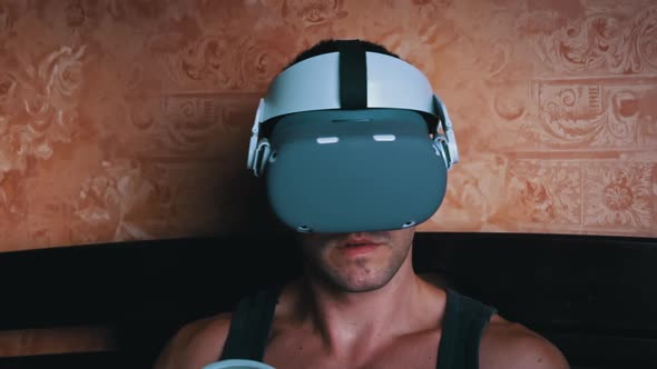 Man in a Virtual Reality Helmet Controls the Controllers