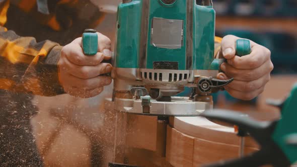 Woodworker Polishes a Top of Wooden Plank