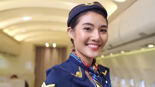 Cabin Crew or Air Hostess Working in Airplane