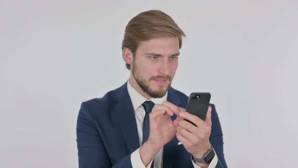 Young Businessman Loss on Smartphone on White Background