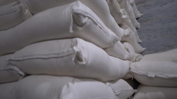 In stock, rice, sugar, cereals and flour are prepared in bags for shipment
