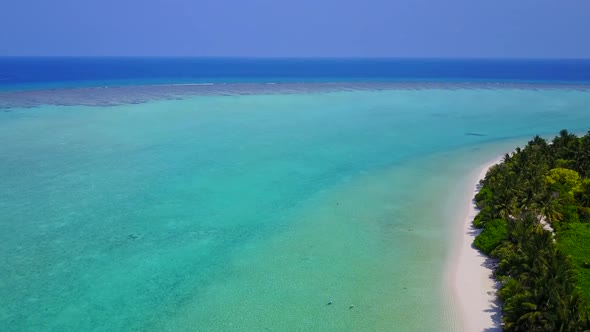 Aerial drone tourism of tropical sea view beach by blue lagoon with sand background