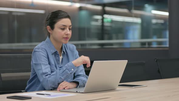 Indian Woman Thinking While Using Laptop