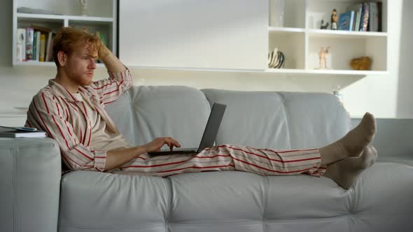 Smiling Student Typing Social Media on Weekend