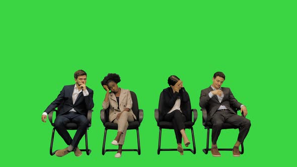 Bored Tired Business People on a Meeting Unable to Concentrate on a Green Screen Chroma Key