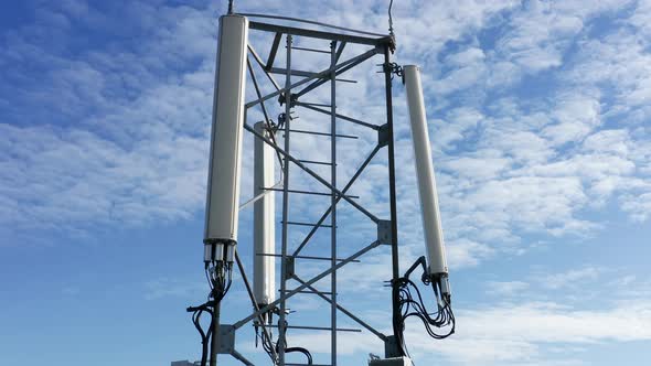 Telecommunications tower carrying broadcasting antennas for 3G, 4G and 5G cellular networks.