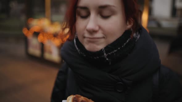 Young Woman Tries Tasty Bubble Waffle Sweat Dessert at Night