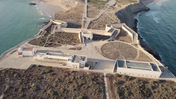 Sagres Fortress and village in background. Aerial top-down circling
