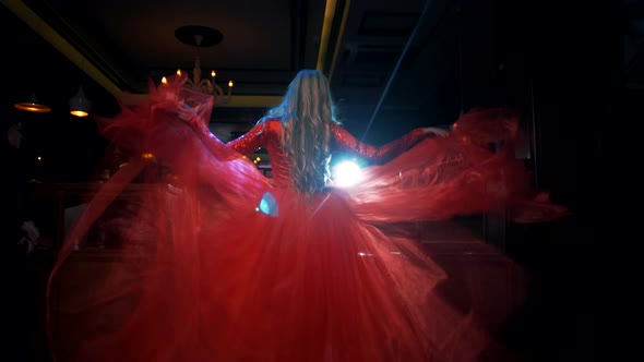 Sexy blonde model goes to a nightclub in a beautiful red dress