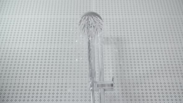 Turning On and Off the Shower Head in Bathroom Water Sprays Out and Flowing Falling Drops alt