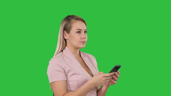 Employee texting sending and reading messages on a Green