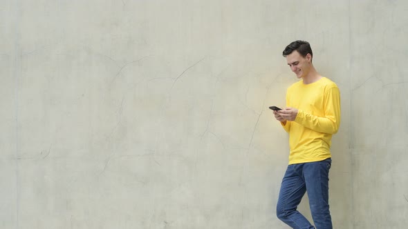 Young Handsome Man Using Phone