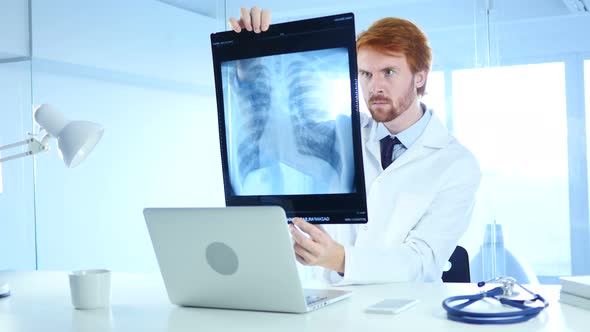 Specialist Doctor Checking X-ray of Patient for Diagnosis