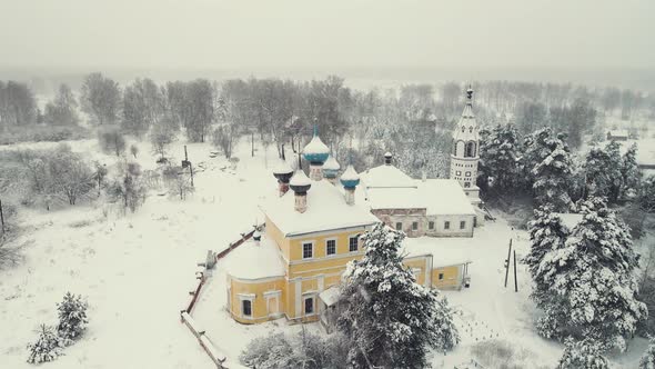 Beautiful Snowy Rural Landscape and Church Winter Aerial View