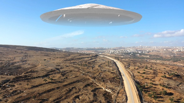 Alien Spaceship ufo Hovering over hills-Aerial view