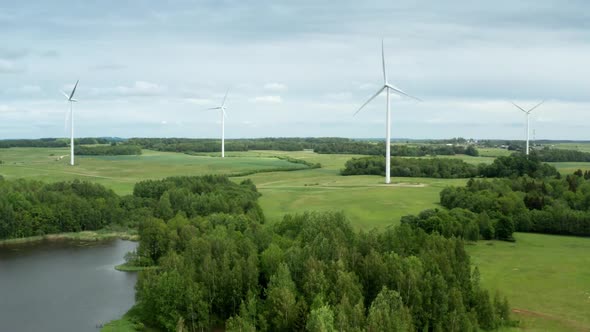 Drone Shot of Windmills Turbine Among Fields