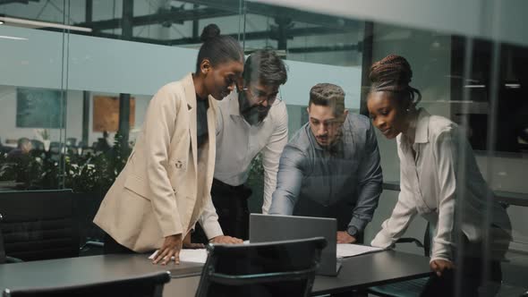 Multiracial Business Team Group of Workers Developers Managers Looking at Laptop in Office