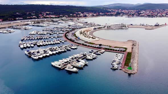 Aerial top view of boats and yachts in marina from above.