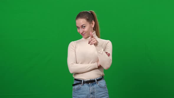 Positive Charming Caucasian Woman Pointing at Camera Smiling