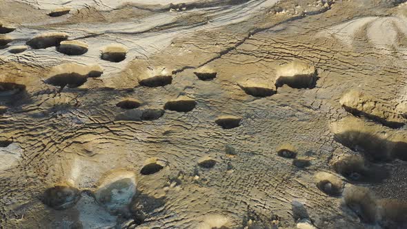 Deadsea, Israel, Fly over small sinkholes to the sea, desert, shot by drone