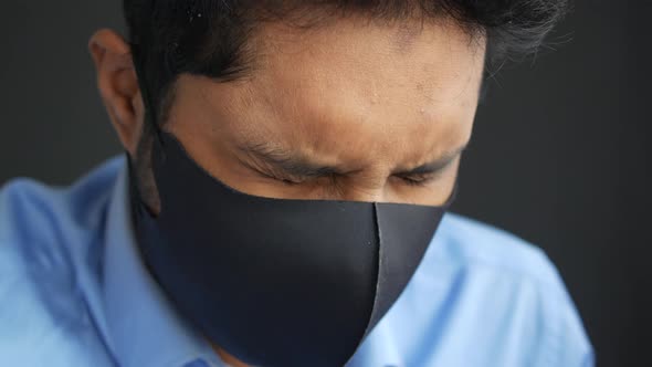 Close Up of Man with Protective Face Mask Taking Deep Breath