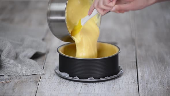 Woman Pouring Custard Cream on Pie Dough