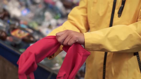 Close Up View of Woman Standing Indoor Put Red Rubber Protective Gloves on Hands