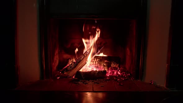 Fire Wood Burning and in Fireplace at Home Giving Warm