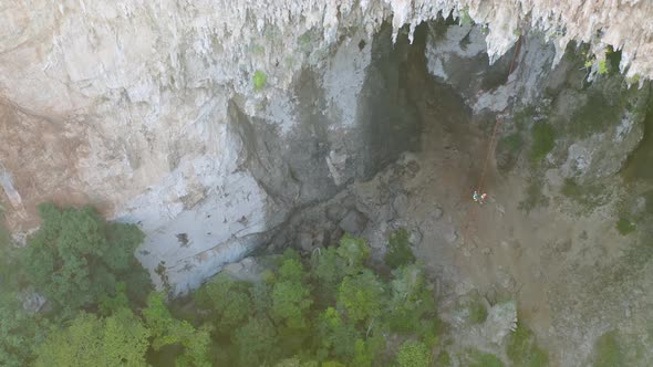 Aerial top view of tourist sprinkle the rope at Spirit Well Cave, Pang Mapha District, Mae Hong Son