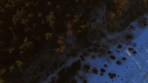 Aerial view of the frozen sea on the coast of Muraste at sunset, Estonia.