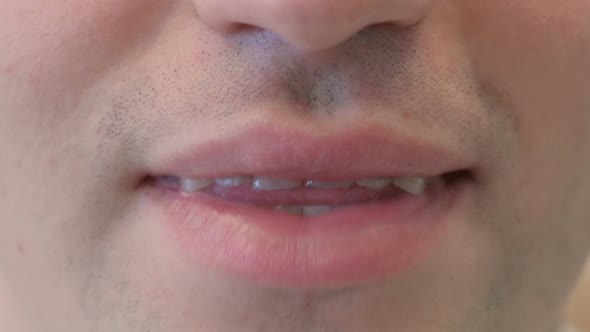 Close Up of Smiling Mouth of Young Man