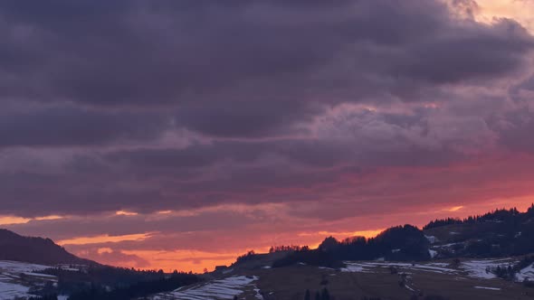 Beautiful twilight at sunset, red hellish clouds, fiery sky, from light to dark,