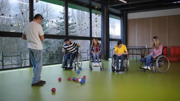Group of Disabled People Playing Bocce Game
