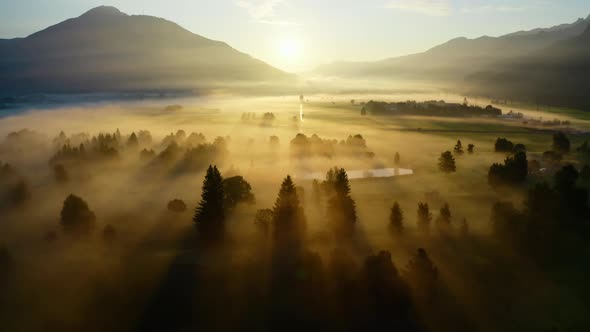 Drone Over Ethereal Misty Landscape Of Zell Am See To Sunrise