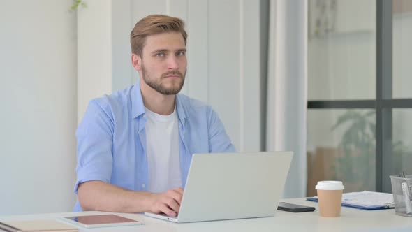 No Gesture By Head Shake By Young Creative Man at Work