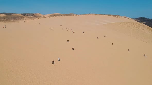 Drone Shot of Sleeping Bear Sand Dunes National Lakeshore in Michigan. People walking or climbing th
