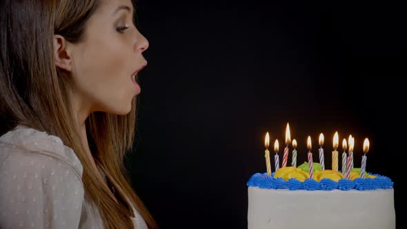 Blowing Out Candles On A Birthday Cake