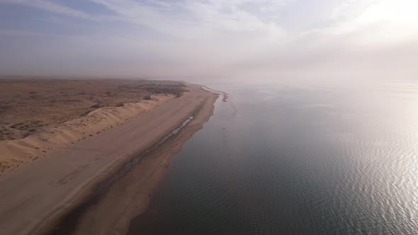 Dawn on the Sandy Beach of the Sea