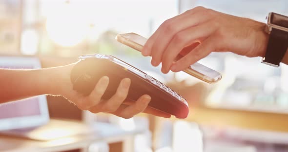 Customer Paying Bill Through NFC Technology