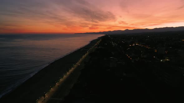 Sea and City at red Sunset