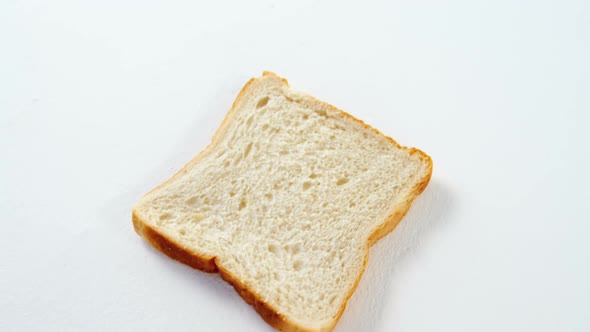Single bread slice on white background
